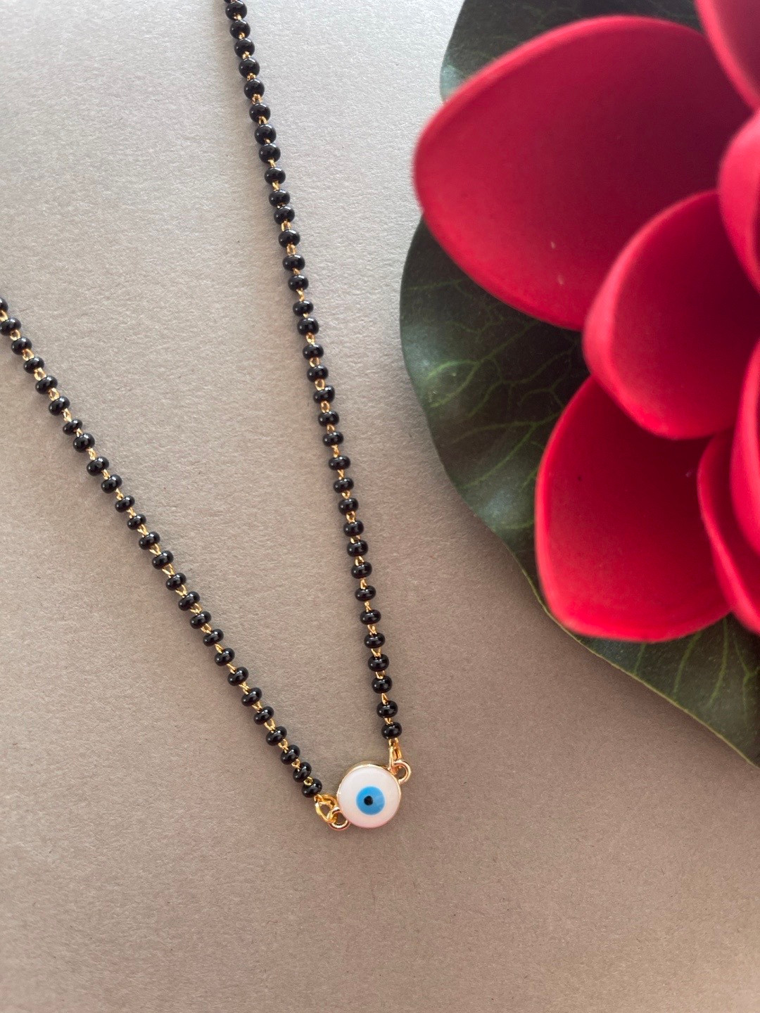 

Digital Dress Room Gold-Plated Black Beaded Evil Eye Mangalsutra