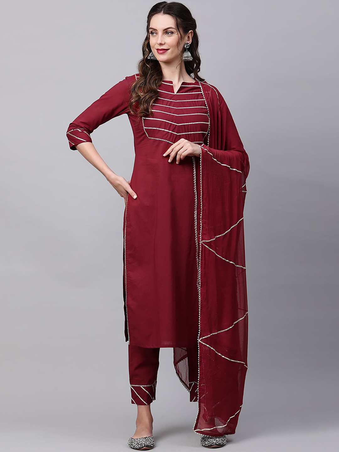 

Indo Era Maroon Yoke Design Cotton Kurta With Trousers & Dupatta Has Gota Patti Detail