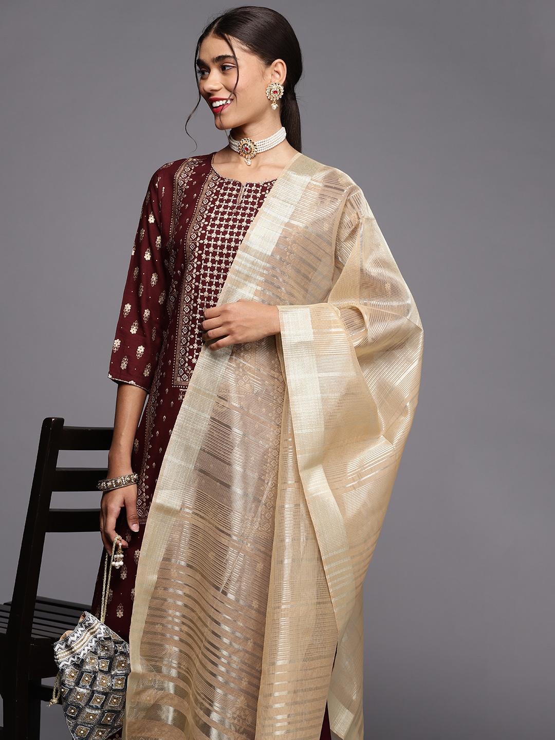 

Indo Era Women Maroon & Golden Ethnic Motifs Printed Kurta with Palazzos