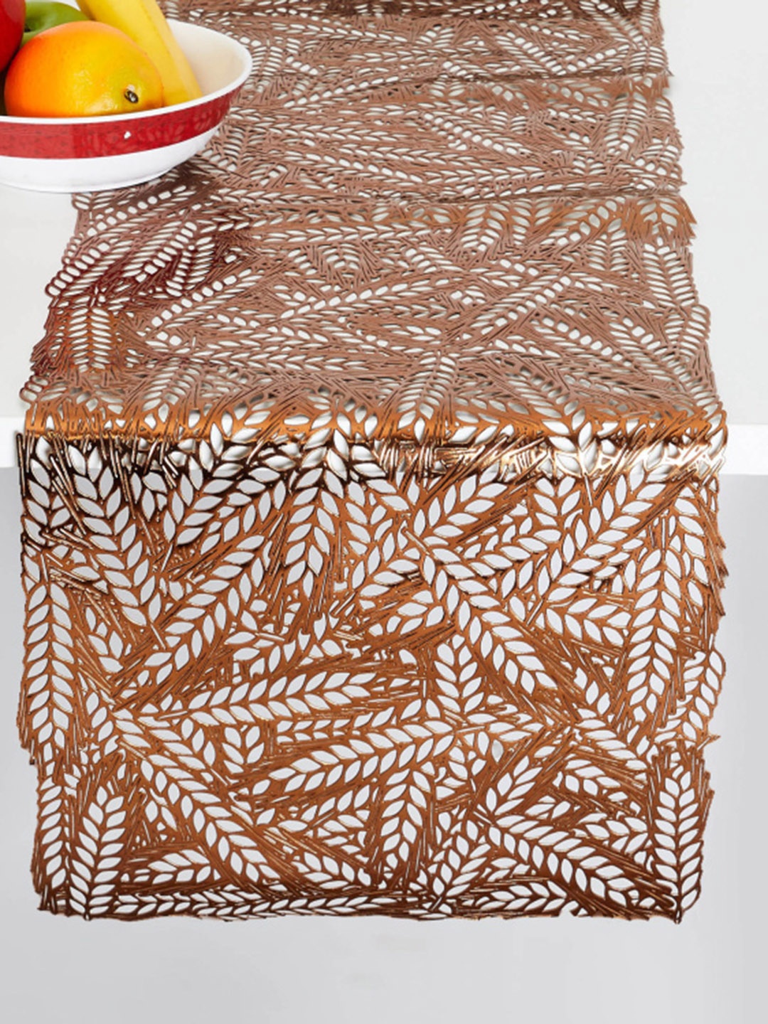 

Home Centre Brown Cinder Leaves Printed PVC Table Runner