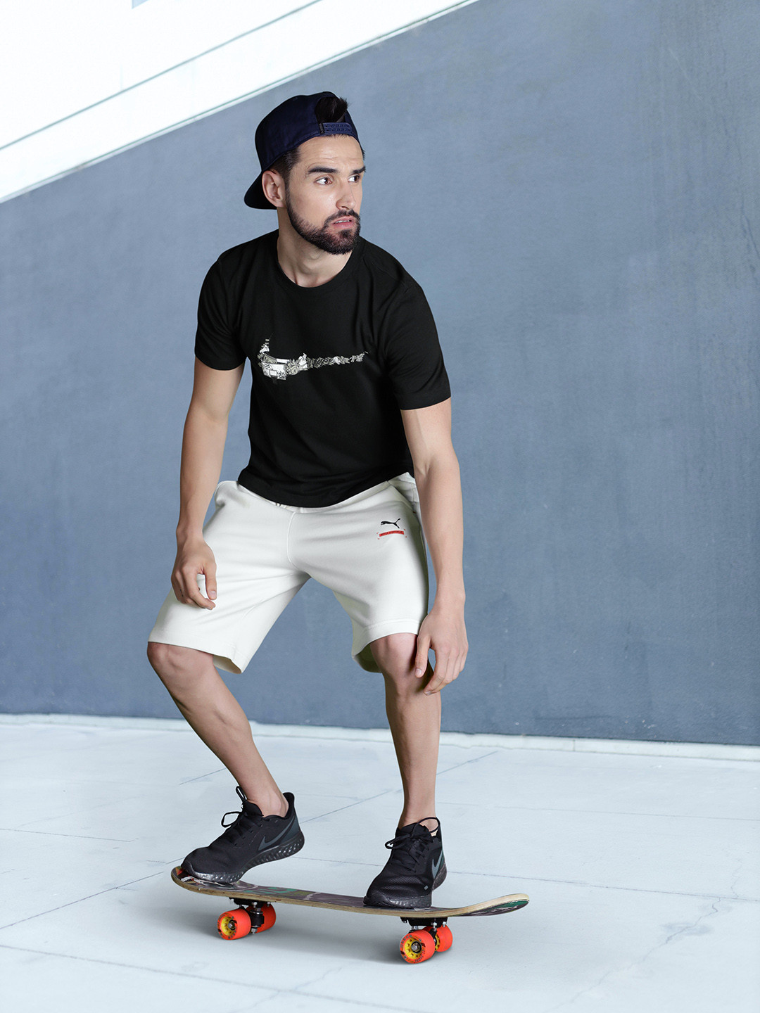 

Nike Men Black & Multicoloured Brand Logo Printed T-shirt