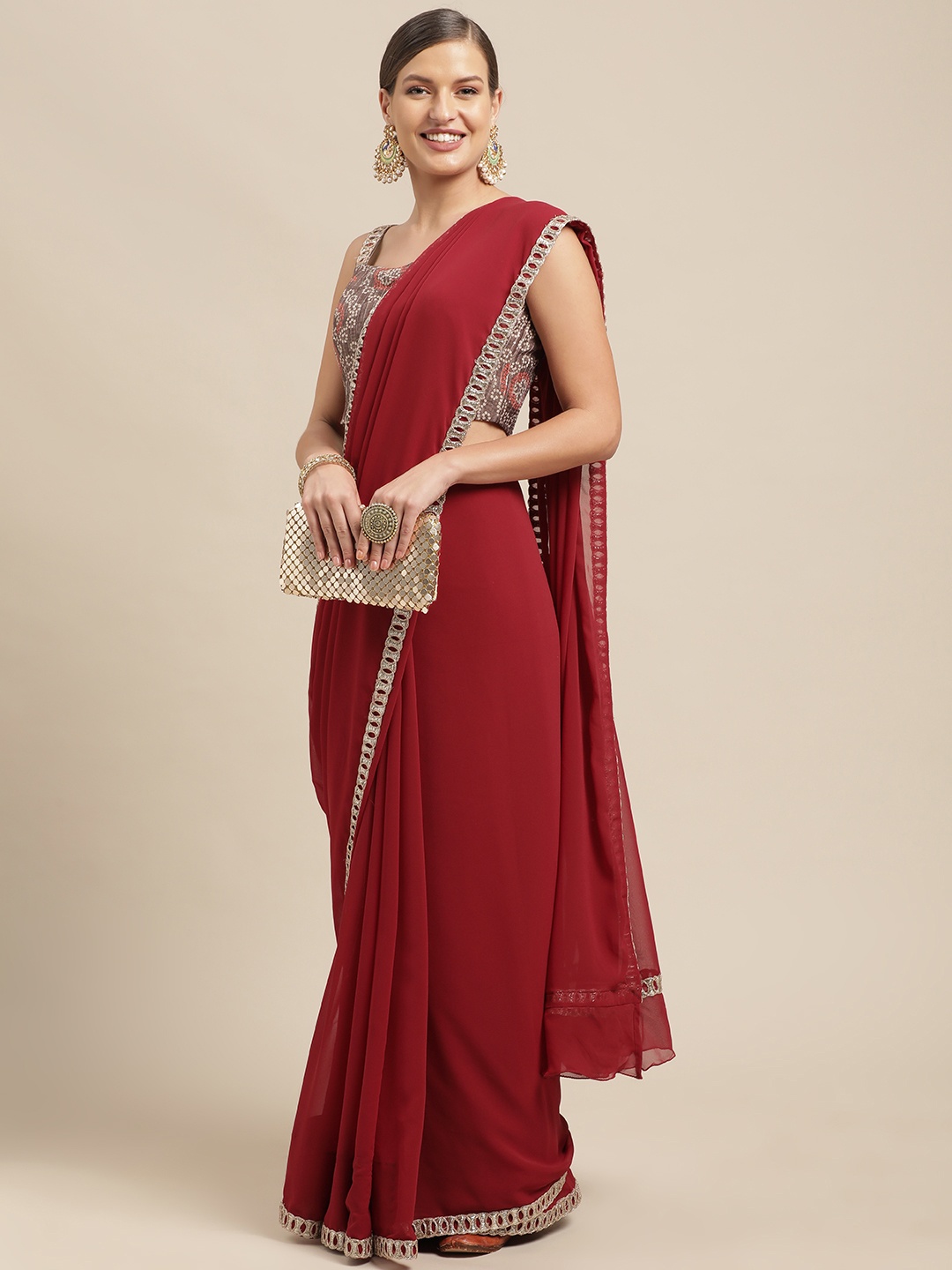 

Ethnovog Maroon Grey Solid Georgette Saree