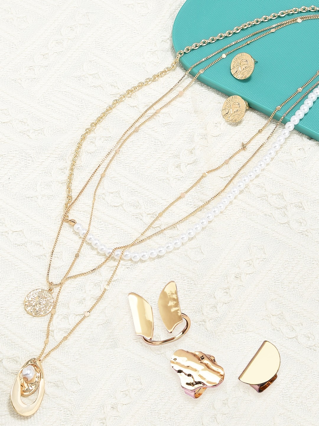 

Ami Gold Plated Contemporary Layered Chains & Rings Set & Earring