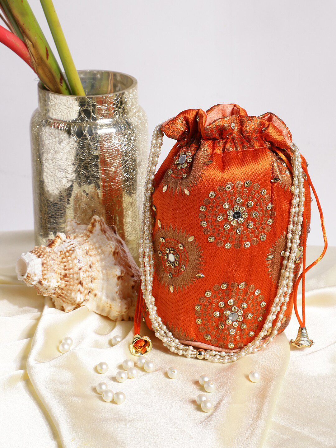 

Athena Orange & Gold-Toned Printed Embellished Potli Clutch
