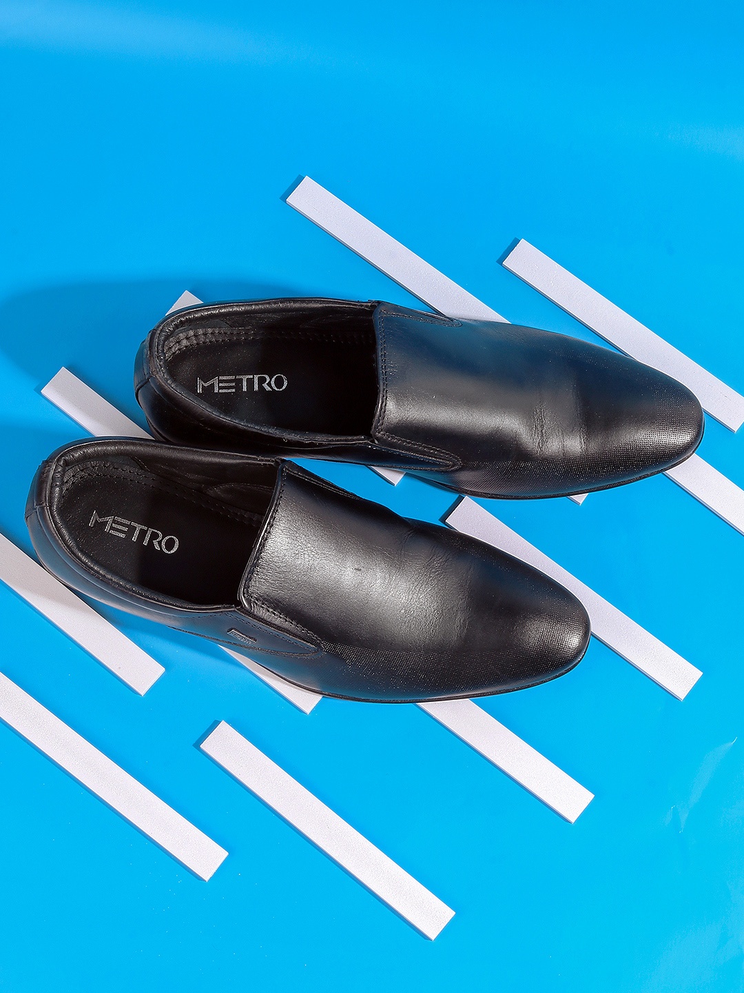 

Mochi Men Black Solid Leather Formal Slip-On Shoes