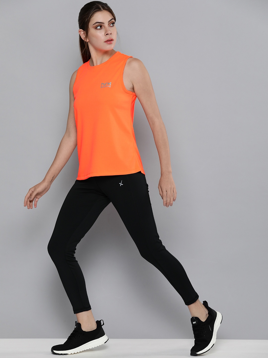 

HRX By Hrithik Roshan Training Women Neon Orange Rapid-Dry Solid Tops