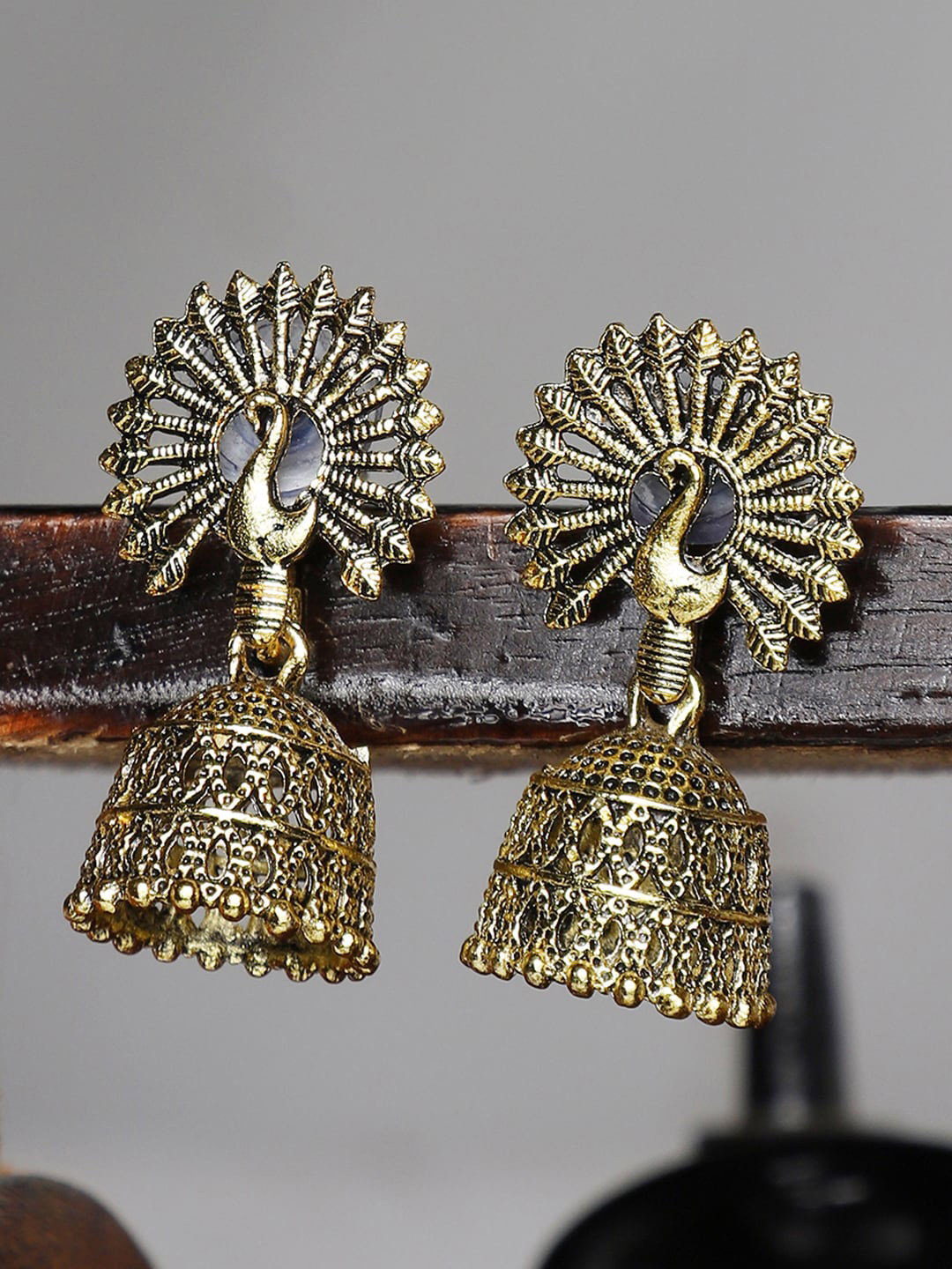 

ANIKAS CREATION Gold-Toned Contemporary Jhumkas Earrings