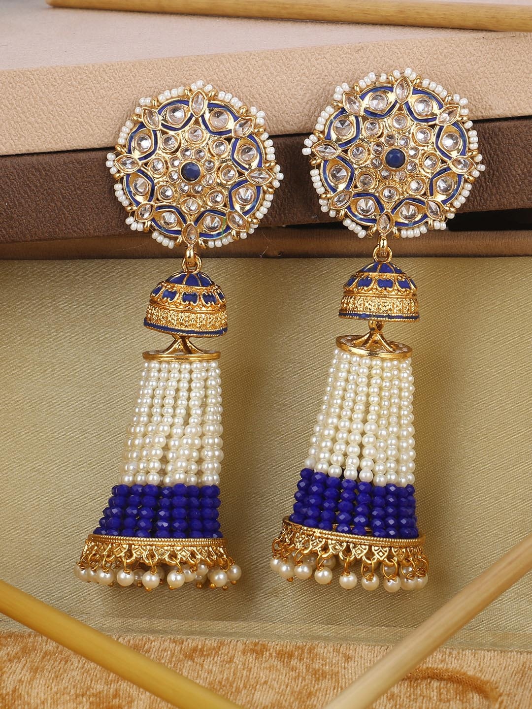 

ANIKAS CREATION Gold-Toned & White Contemporary Jhumkas Earrings