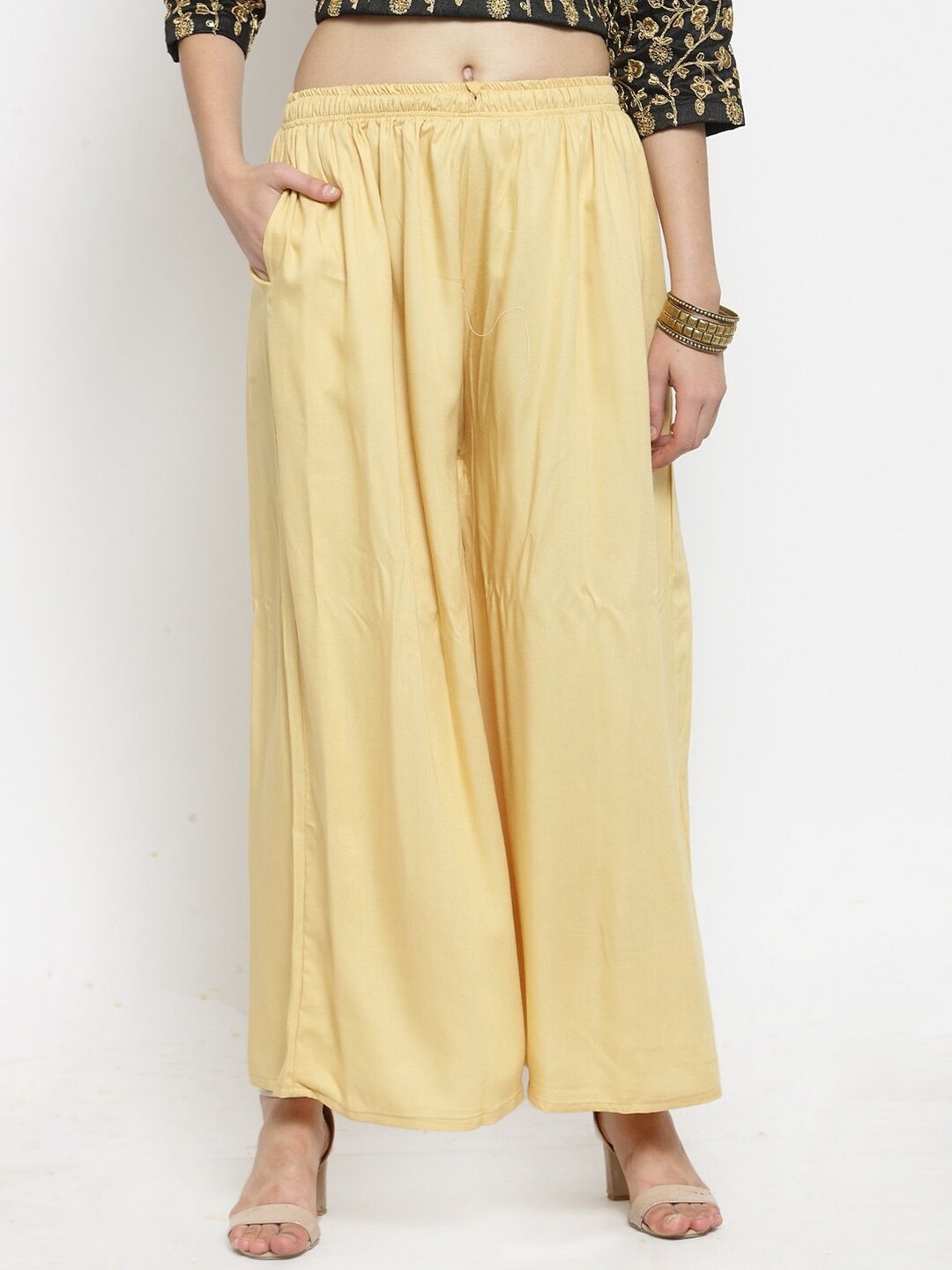 

Clora Creation Women Beige Solid Wide Leg Fit Palazzos