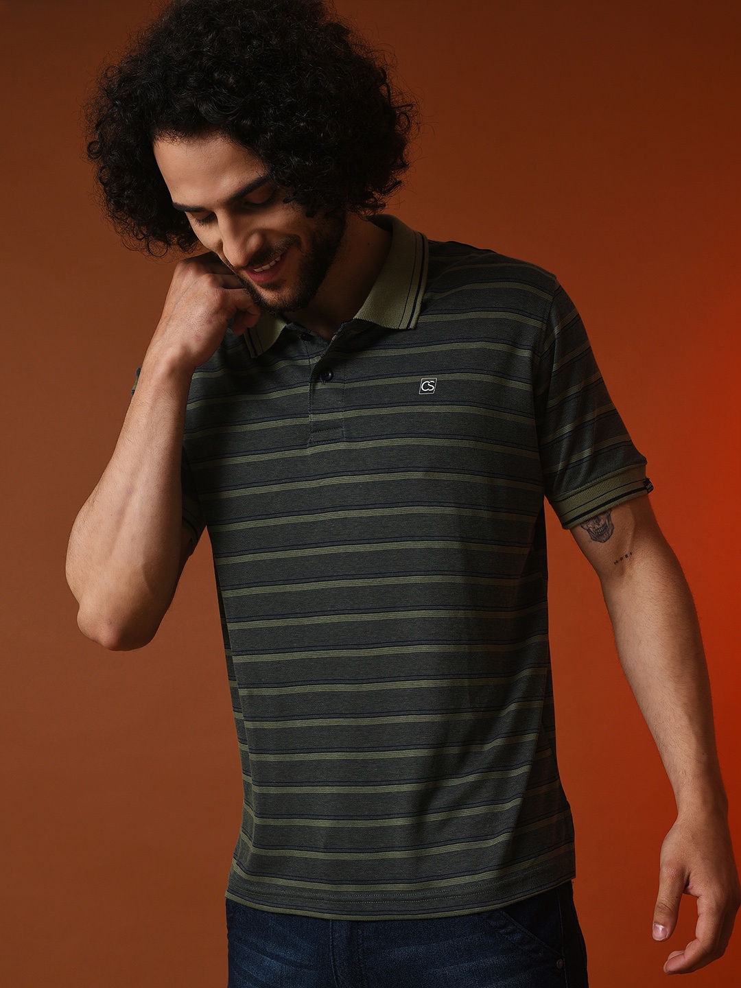 

Campus Sutra Men Olive Green Striped Polo Collar Outdoor Cotton T-shirt