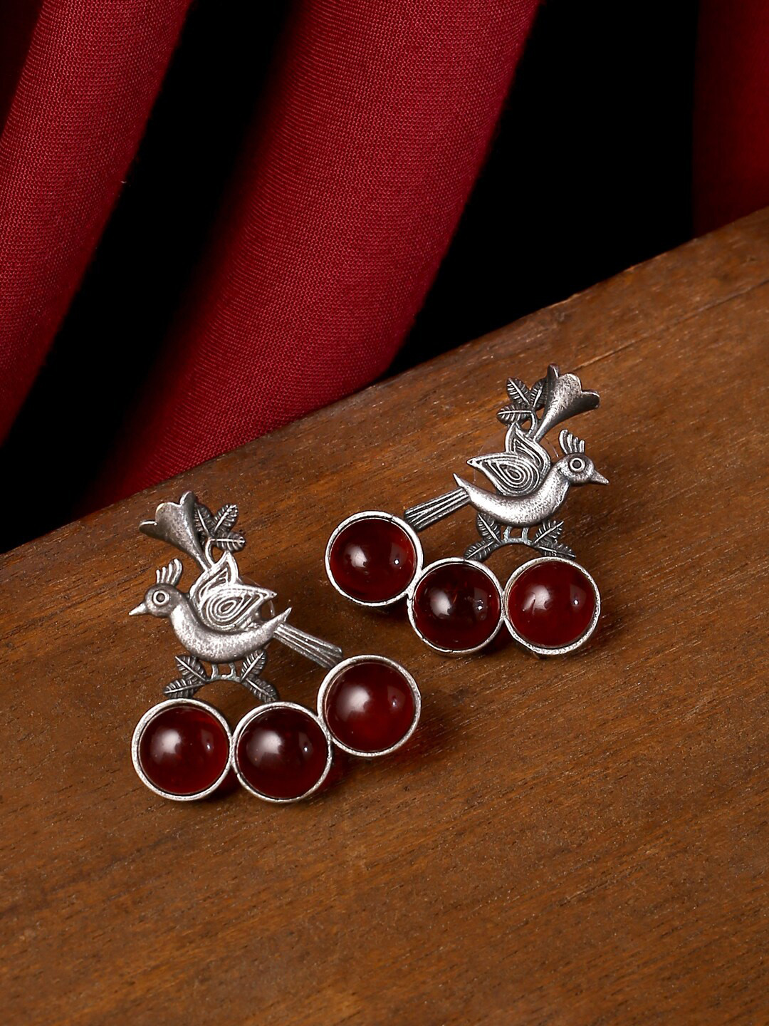 

VIRAASI Women Silver-Toned & Maroon Bird Design Studs Earrings