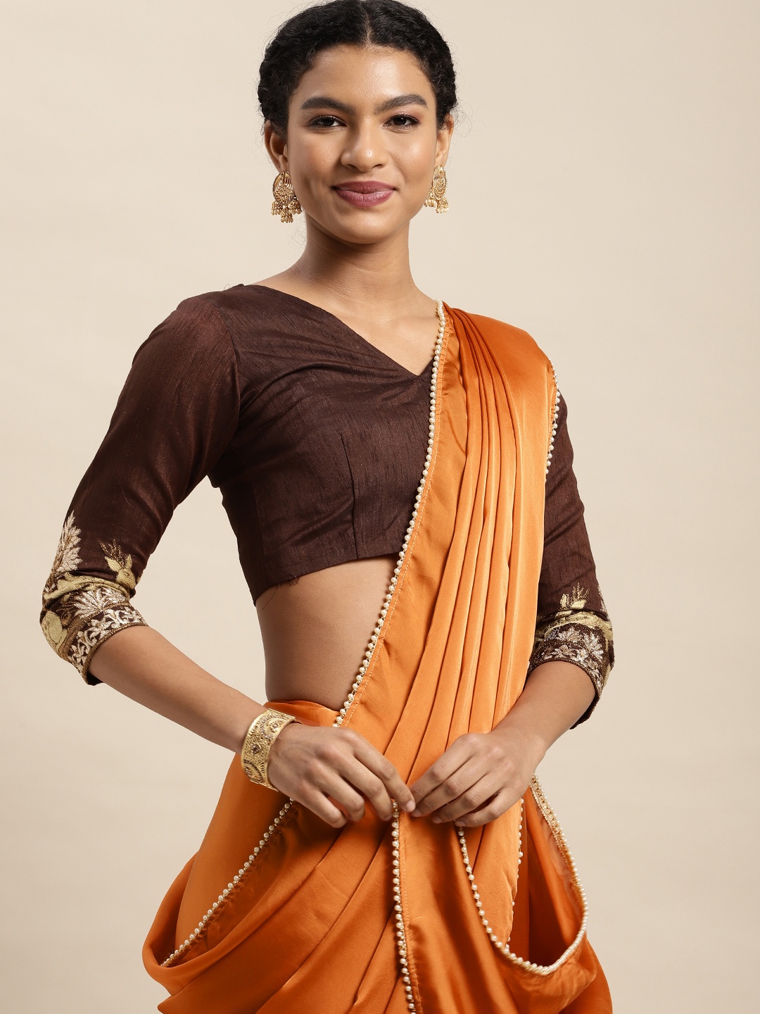 

Mitera Rust Orange Solid Satin Saree
