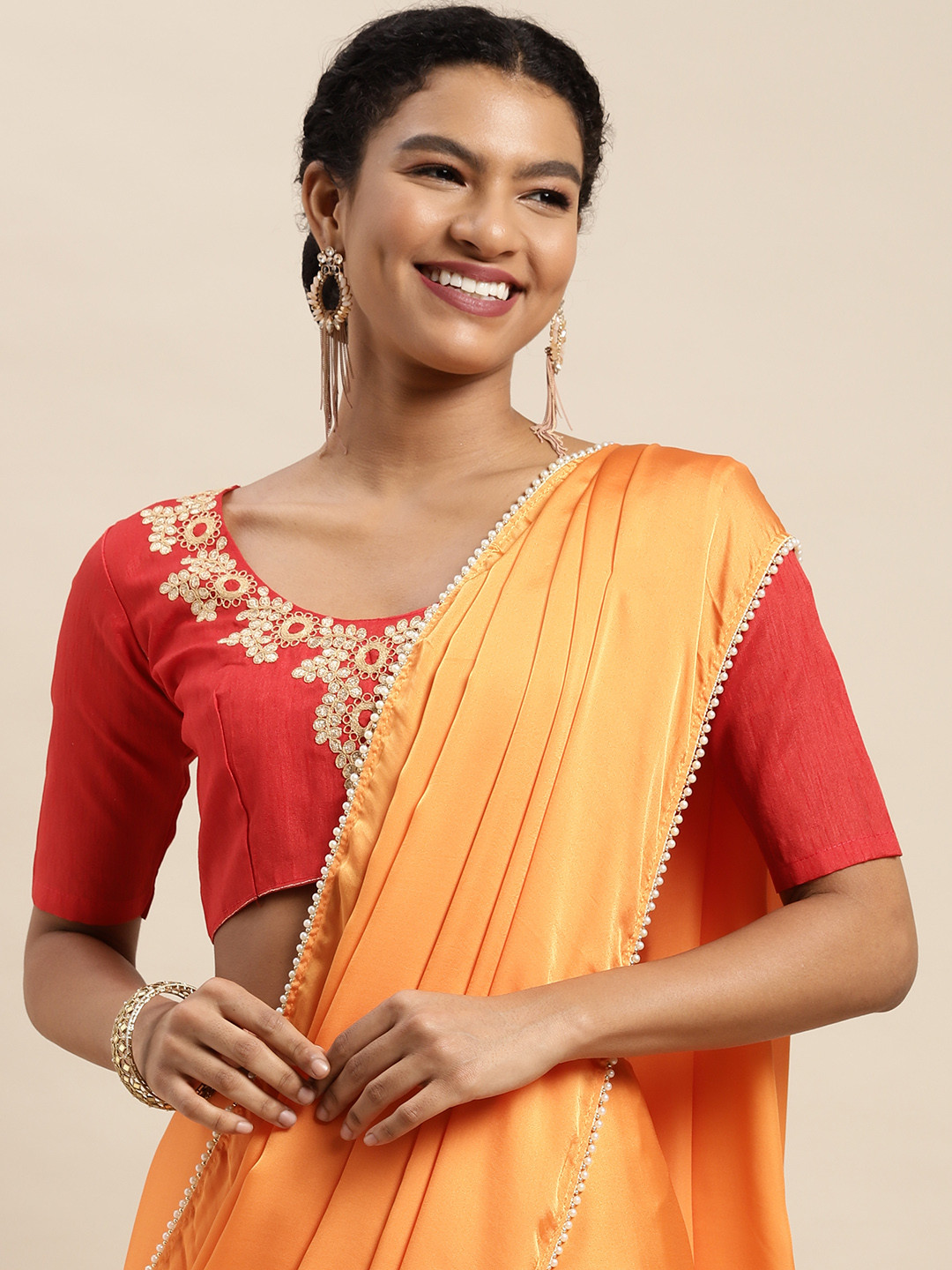 

Mitera Orange Solid Satin Saree