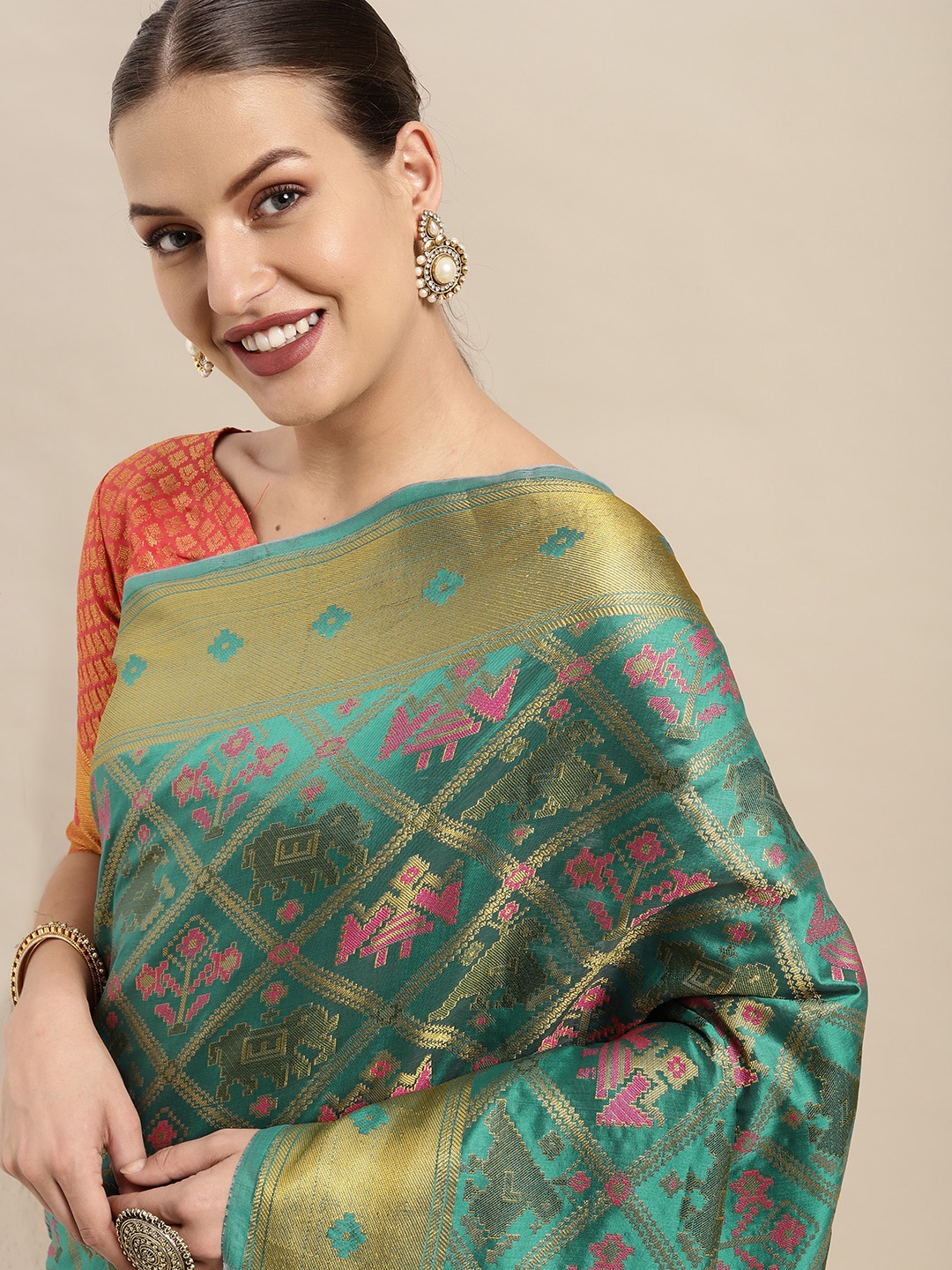

Mitera Green & Orange Ethnic Motifs Zari Silk Blend Patola Saree