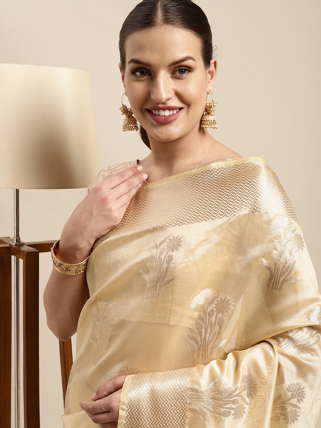 

Mitera Beige & Golden Ethnic Motifs Zari Organza Kanjeevaram Saree