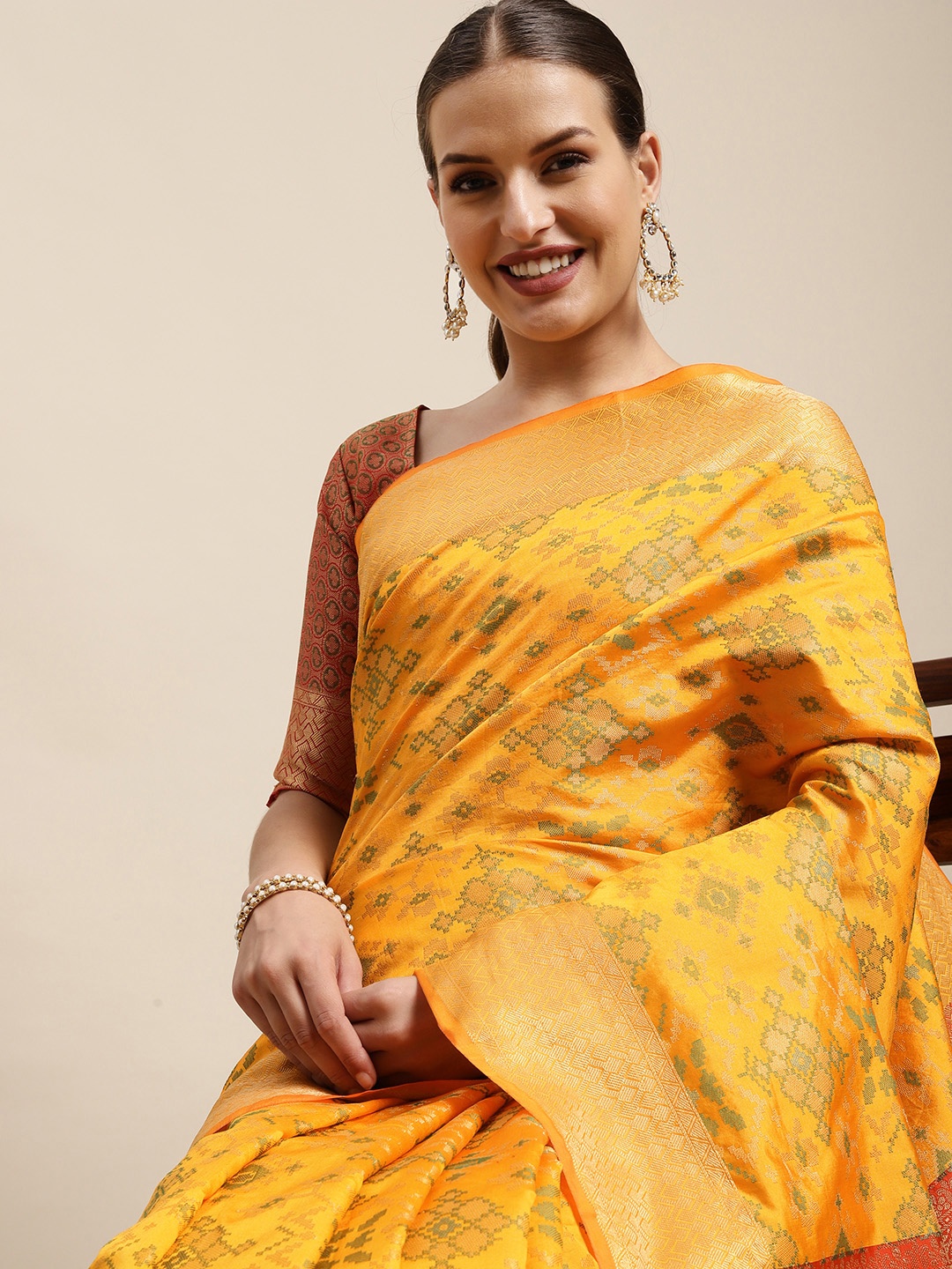 

Mitera Mustard & Red Ethnic Motifs Zari Silk Blend Patola Saree