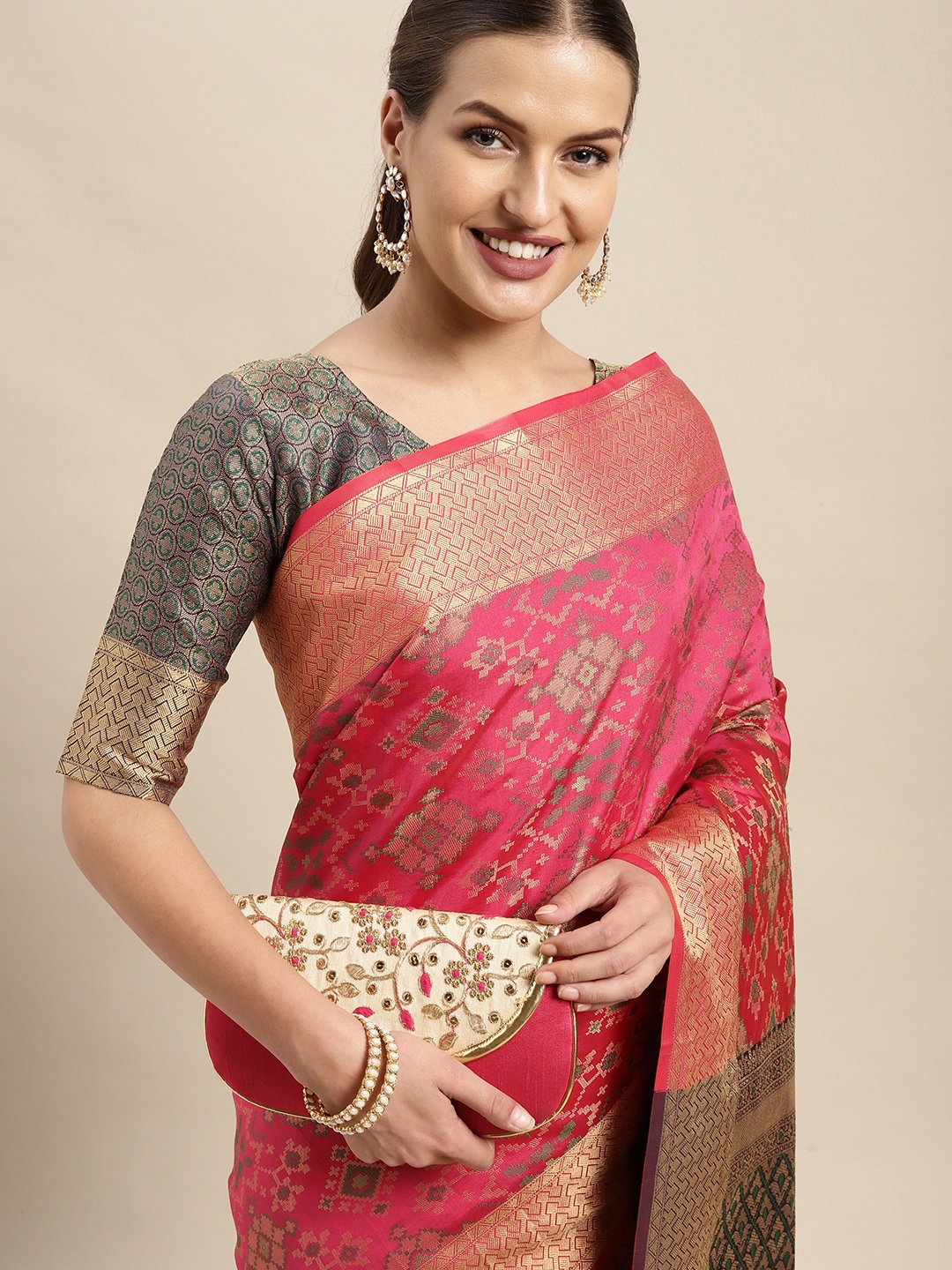 

Mitera Pink & Golden Ethnic Motifs Zari Silk Blend Patola Saree