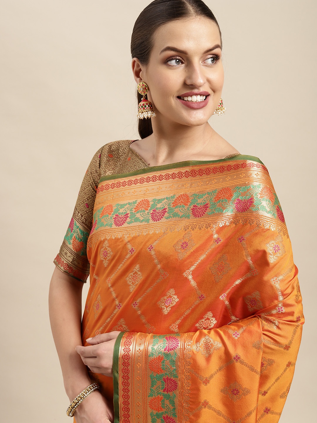 

Mitera Orange & Golden Ethnic Motifs Zari Silk Blend Kanjeevaram Saree