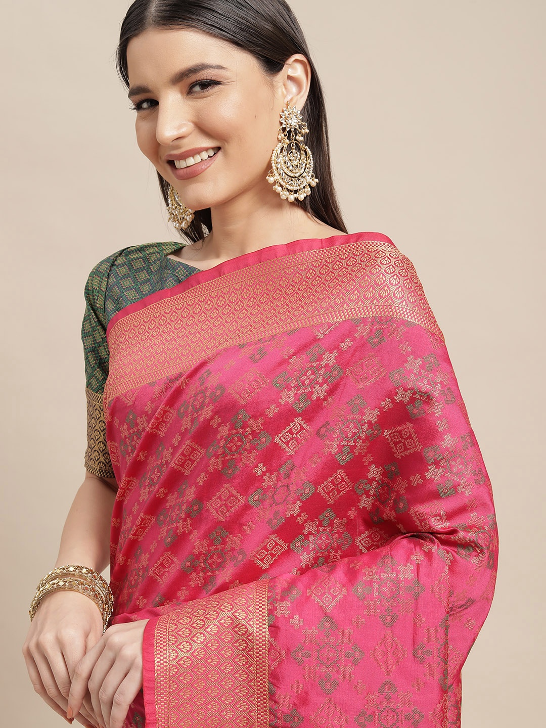 

Mitera Pink & Green Ethnic Motifs Zari Silk Blend Patola Saree