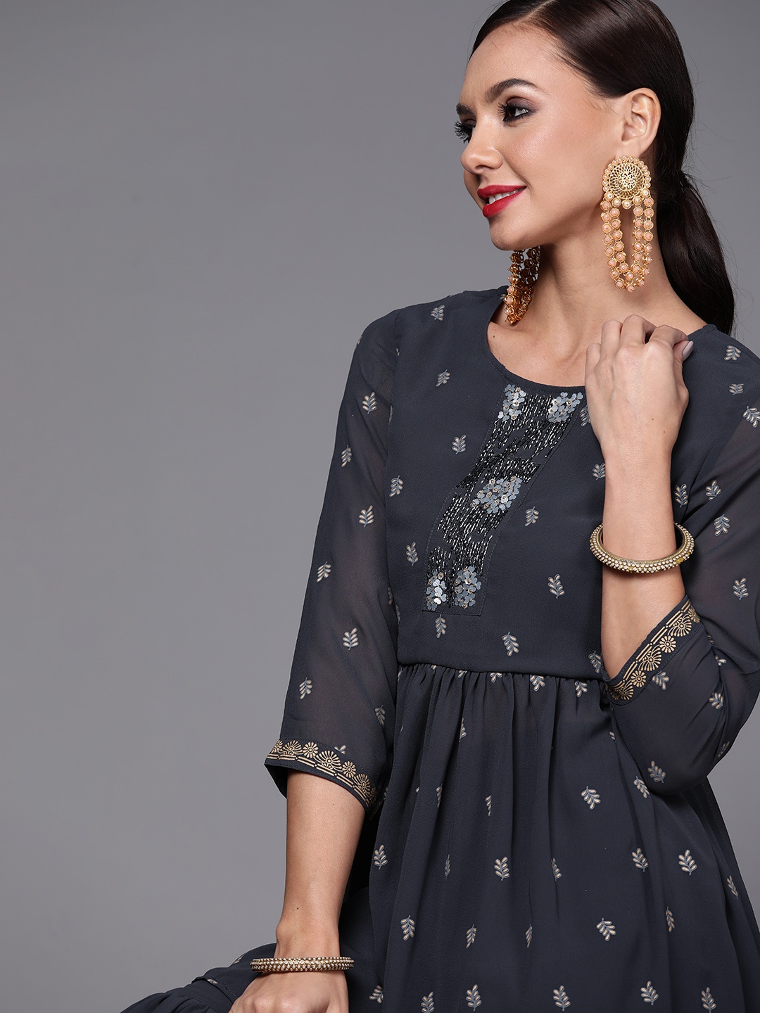 

Indo Era Women Navy Blue Printed Pleated Beads and Stones Kurta with Sharara