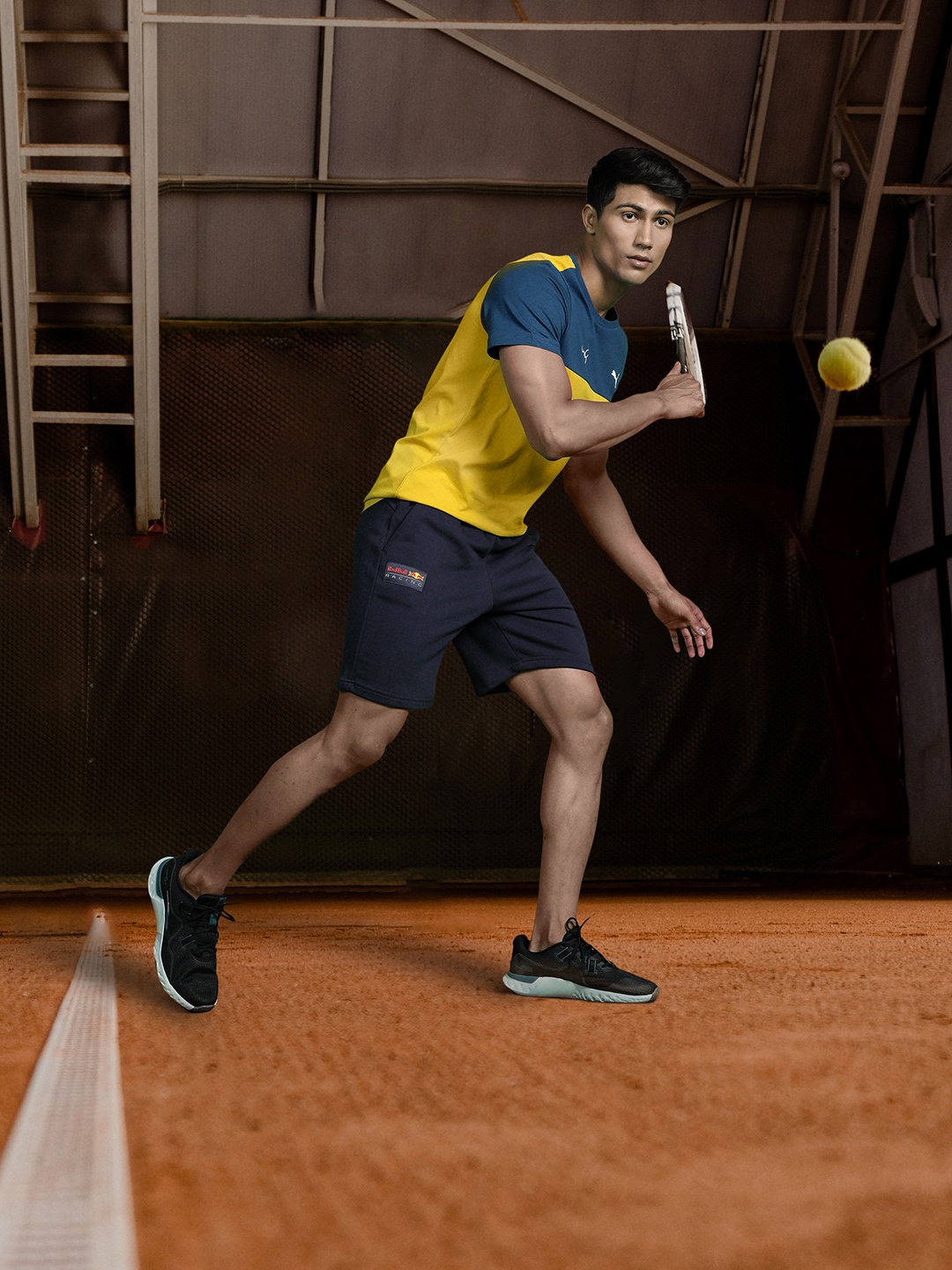 

one8 x PUMA Men Mustard Yellow & Teal Blue Colourblocked Slim Fit T-shirt