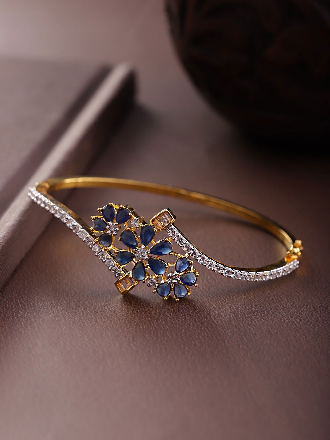 

Priyaasi Women Gold-Toned & Blue Brass American Diamond Gold-Plated Bangle-Style Bracelet