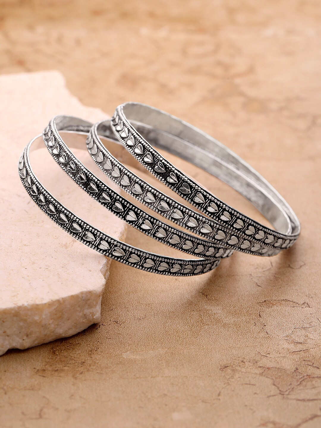 

Priyaasi Women Set Of 4 Silver-Plated Oxidized Engraved Heart-Shaped Bangles