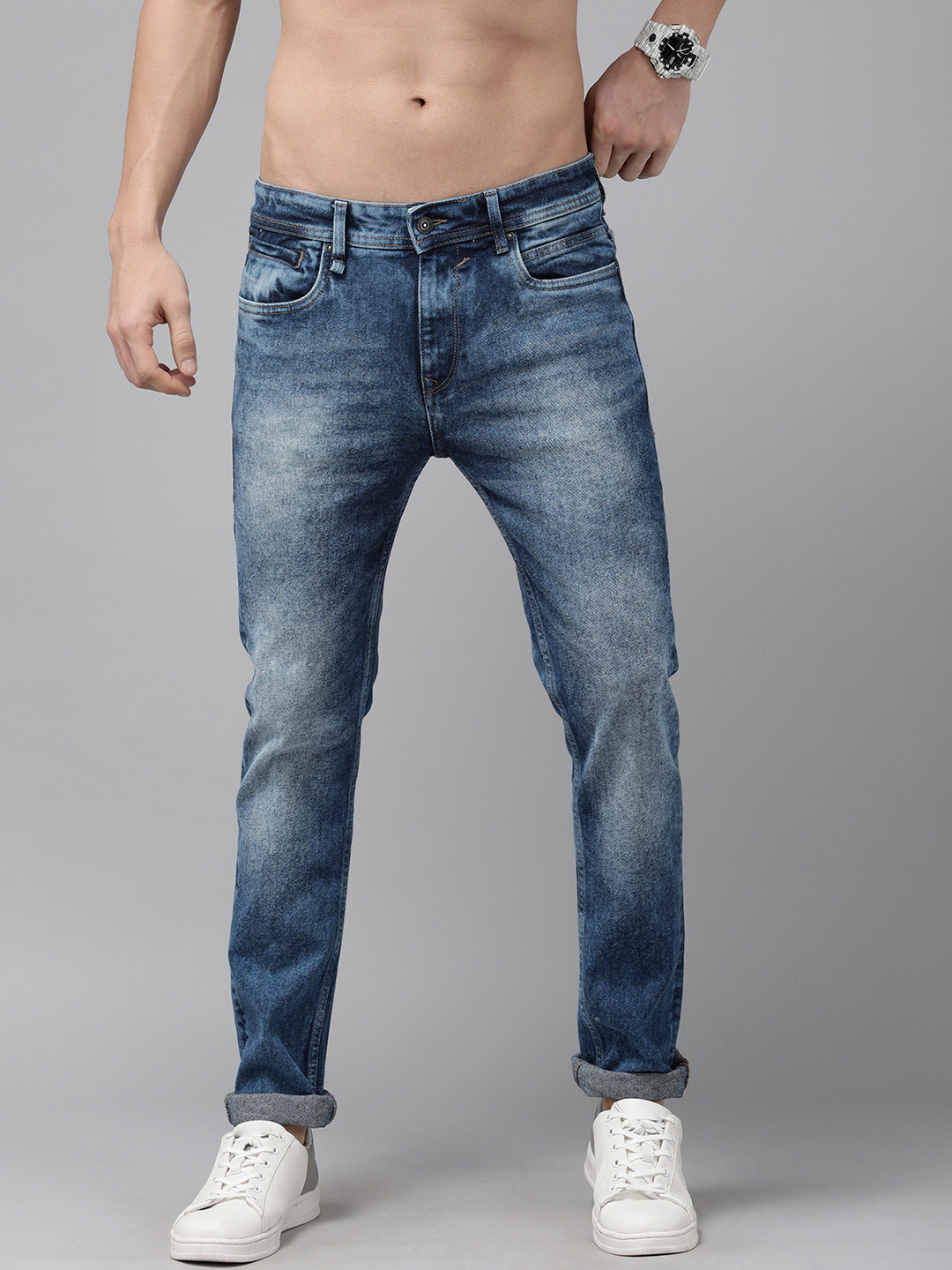 

The Roadster Lifestyle Co Men Blue Tapered Fit Heavy Fade Stretchable Jeans