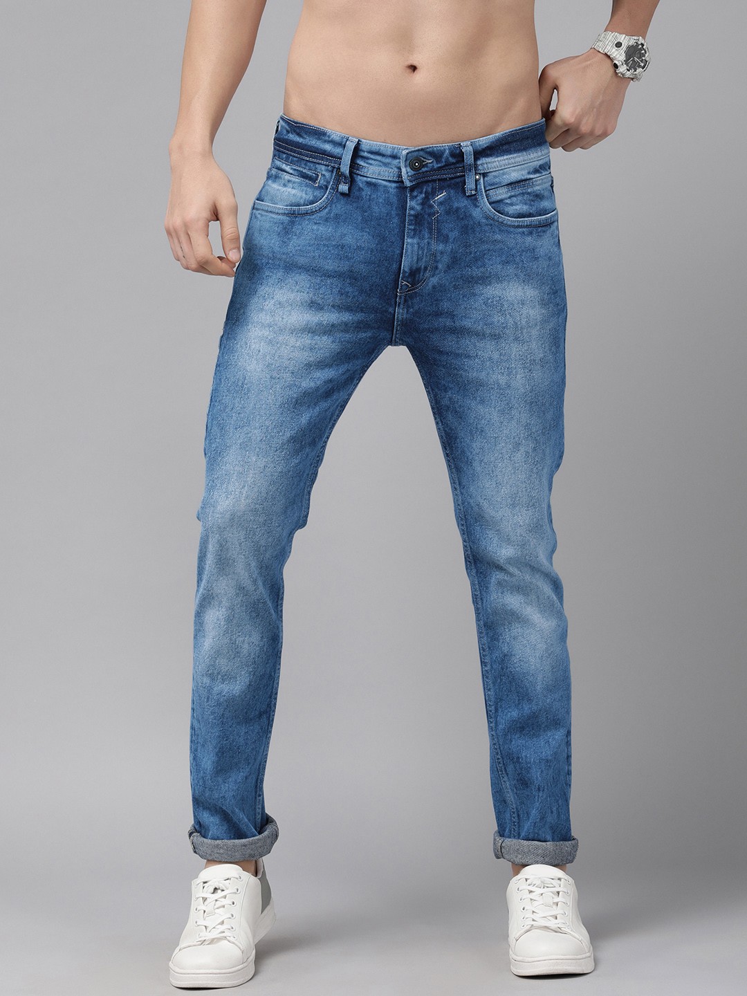 

The Roadster Lifestyle Co Men Blue Tapered Fit Mid-Rise Heavy Fade Stretchable Jeans