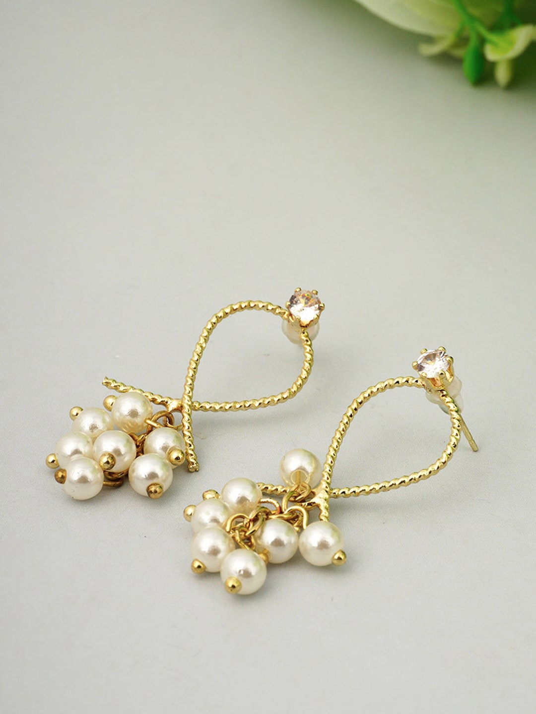 

Ferosh Gold-Toned & White Contemporary Jhumkas Earrings