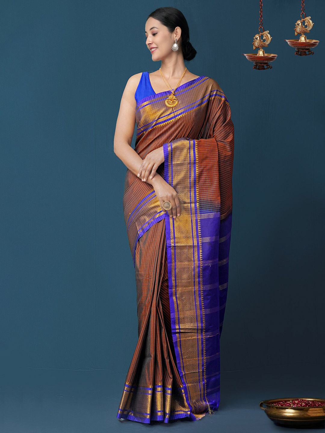 

Unnati Silks Rust & Blue Checked Narayanpet Poly Silk Saree