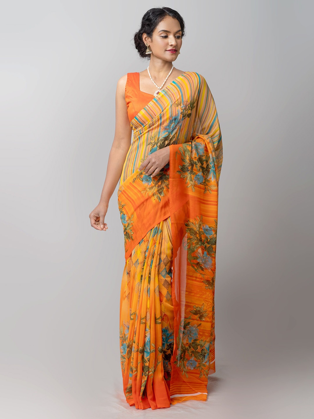 

Unnati Silks Orange & Teal Green Floral Patola Saree