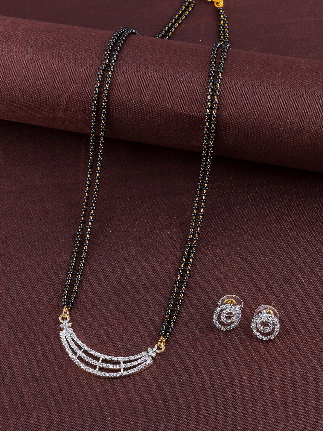 

Brandsoon Women Gold-Plated Black & White AD-Studded & Beaded Mangalsutra With Earrings