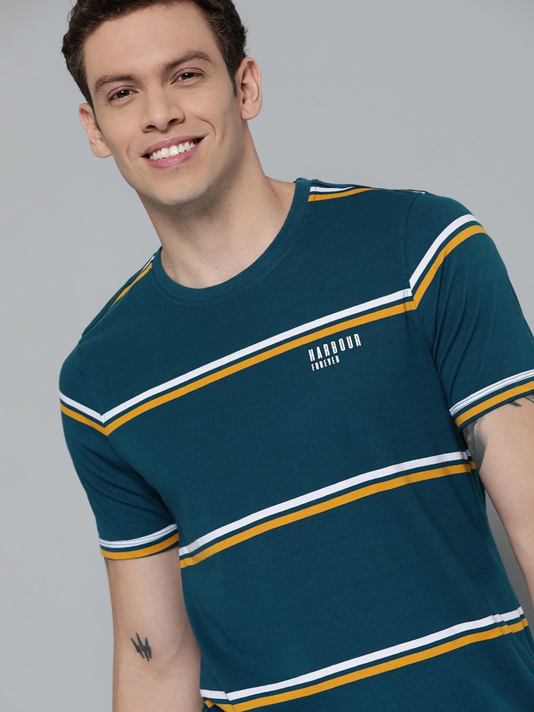 

Mast & Harbour Men Teal Blue & Yellow Striped T-shirt
