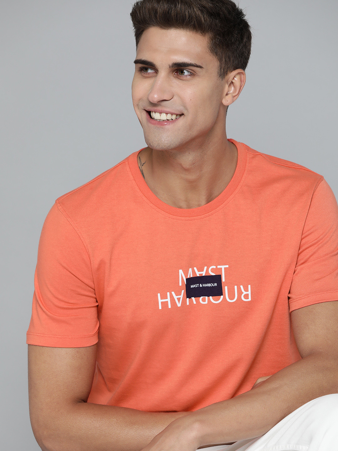 

Mast & Harbour Men Coral Orange Brand Logo Printed T-shirt