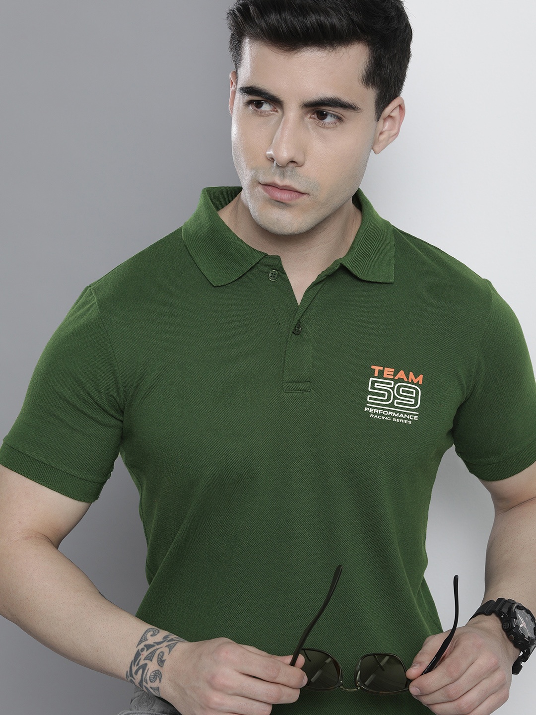 

The Indian Garage Co Men Typography Printed Polo Collar Slim Fit T-shirt, Green