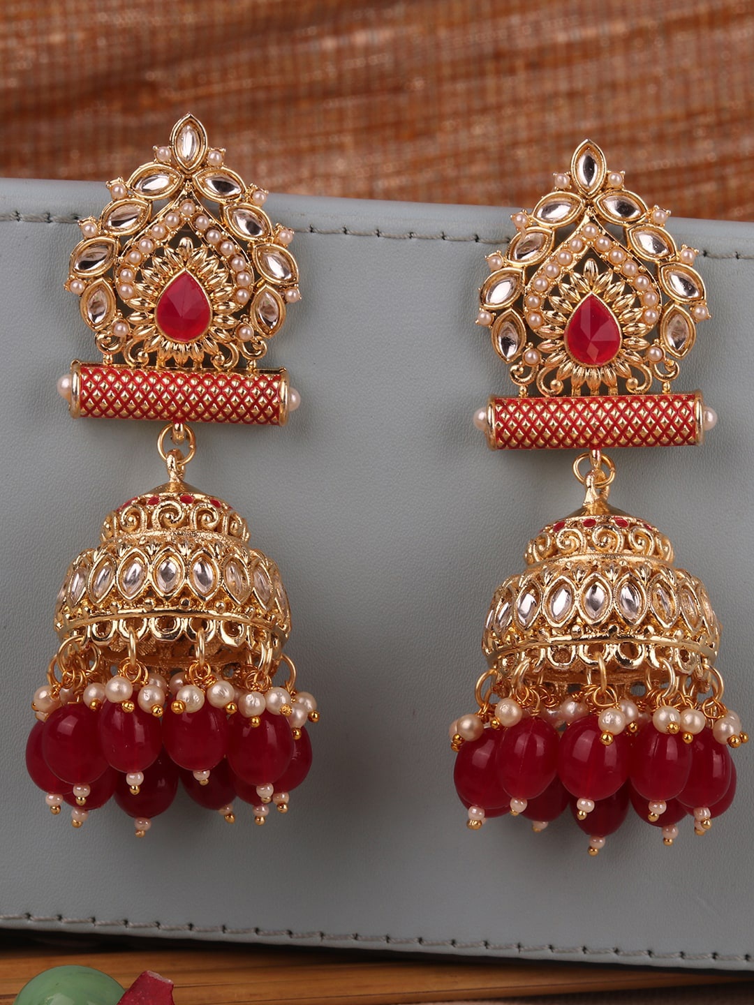 

ANIKAS CREATION Gold-Toned & Red Dome Shaped Jhumkas Earrings