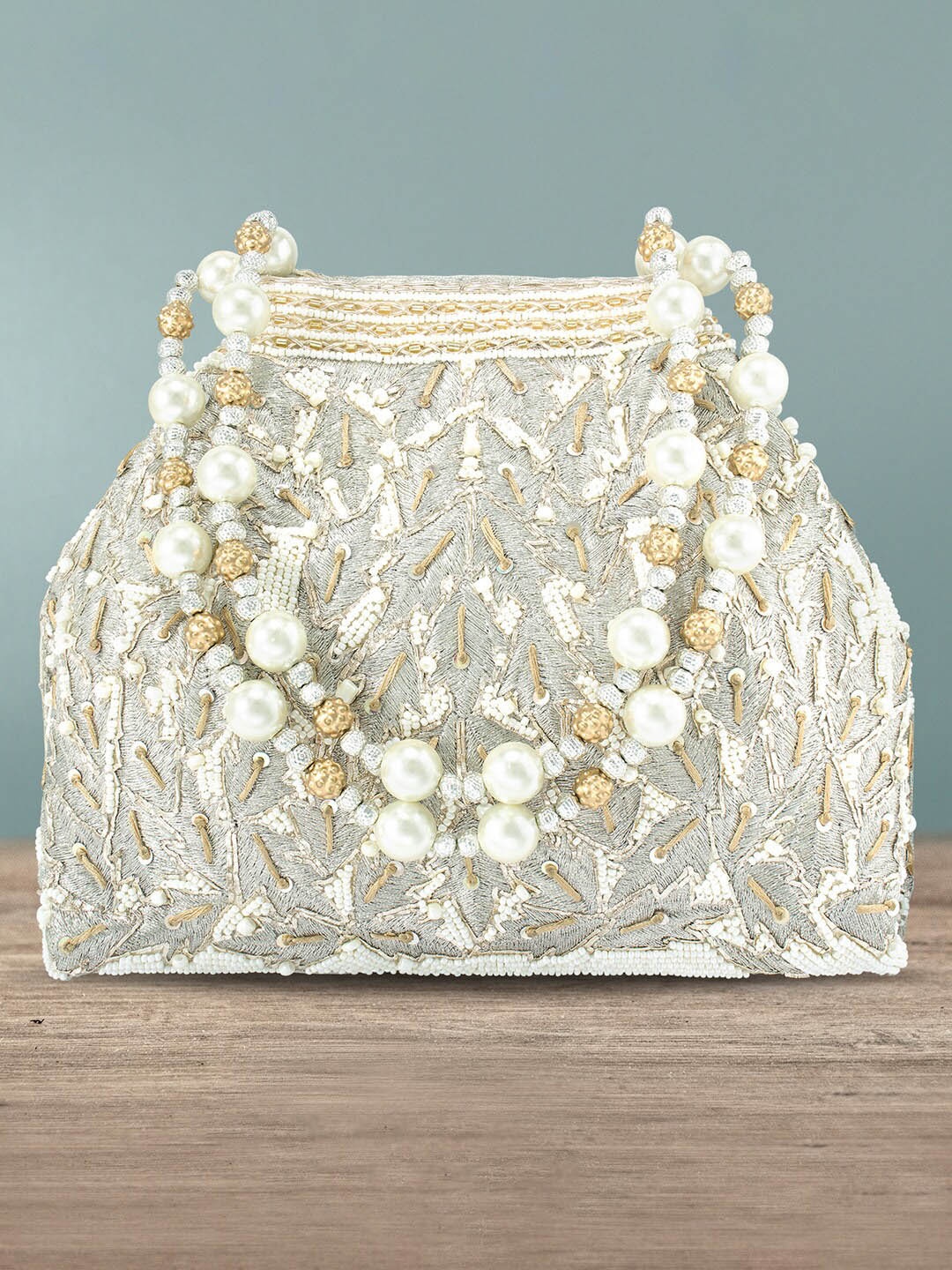 

Peora Off-White & Silver-Toned Embellished Potli Clutch