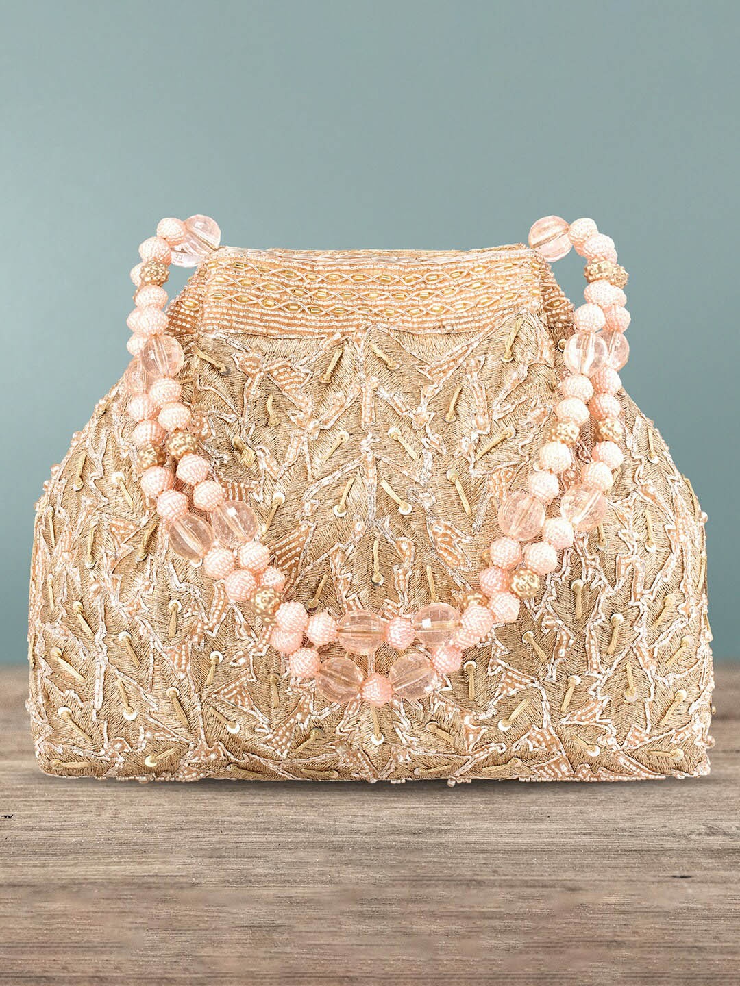 

Peora Rose Gold Embellished Potli Clutch