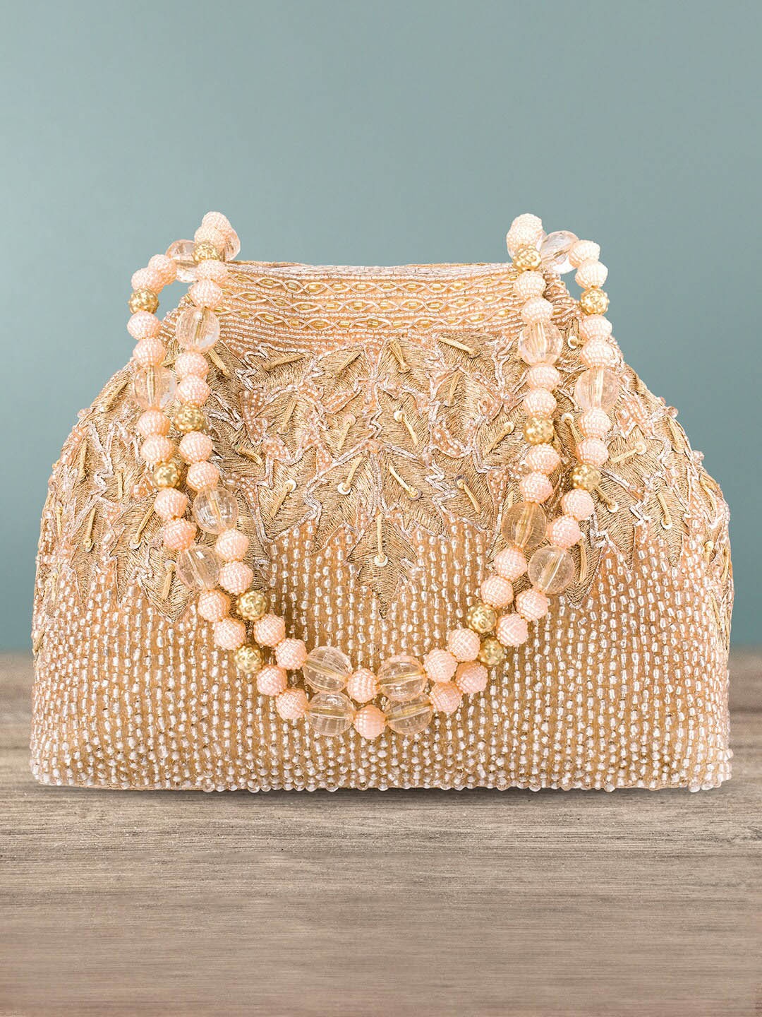 

Peora Rose Gold Embellished Potli Clutch