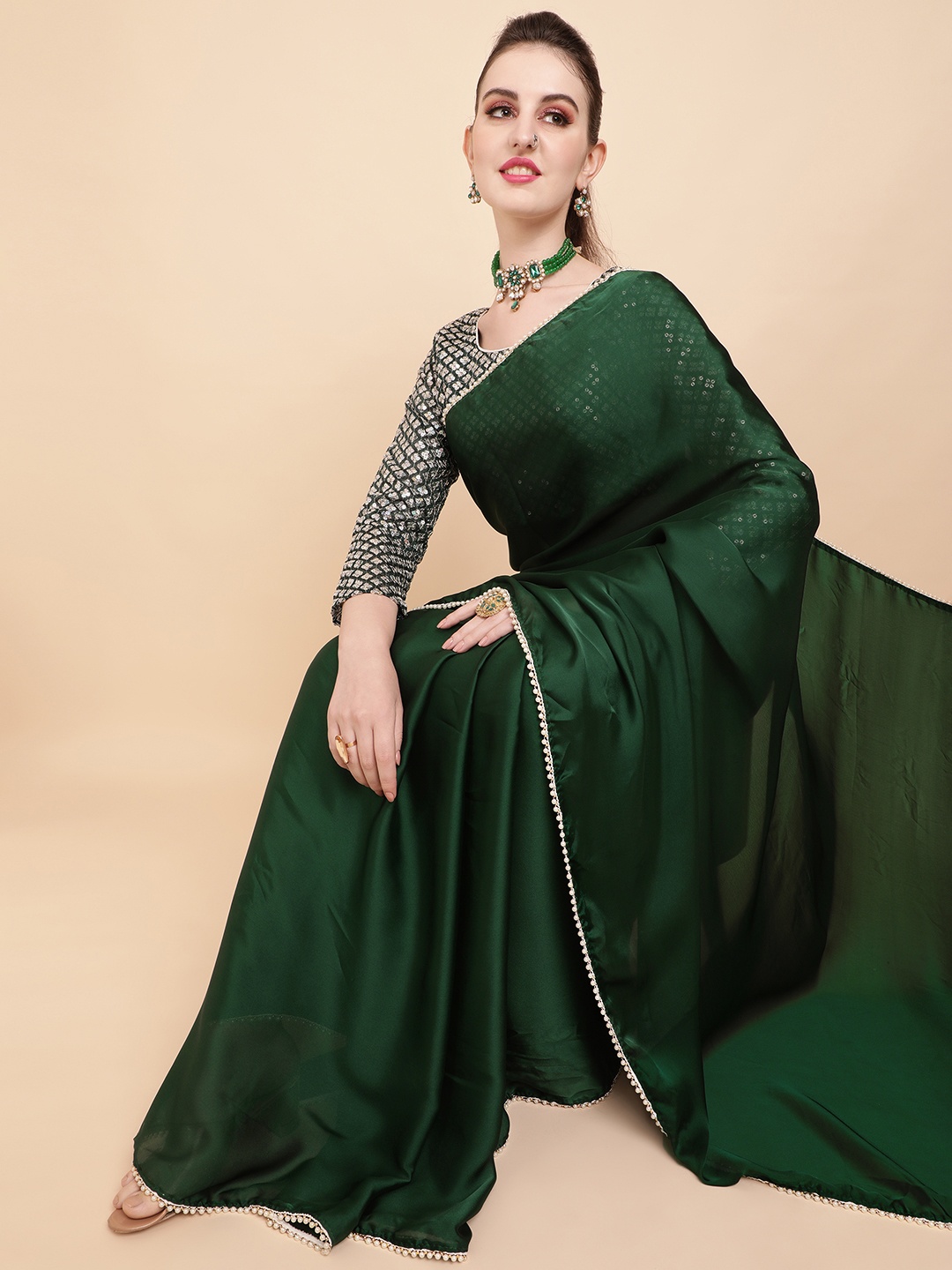 

Sangria Green Sequinned Satin Saree