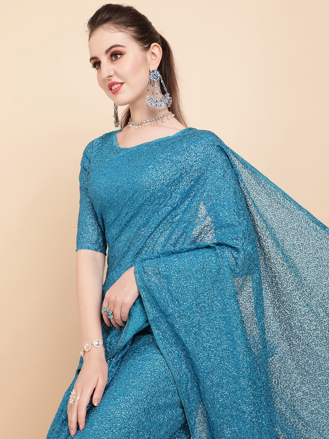 

Sangria Teal Embellished Sequinned Pure Georgette Saree