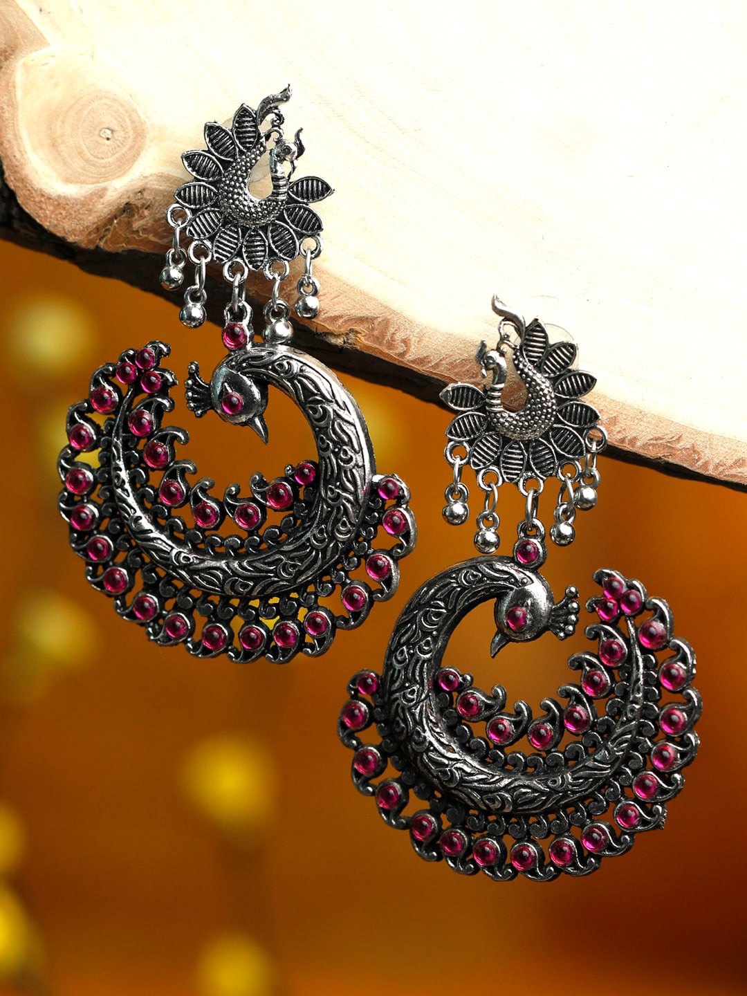 

Priyaasi Women Silver-Toned & Pink Peacock Shaped Chandbalis Earrings