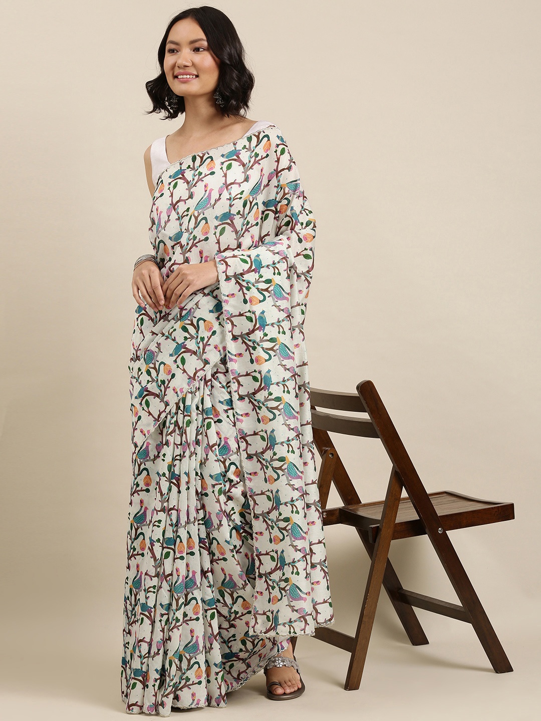 

Suta White & Teal Blue Pure Silk Ethnic Print Saree