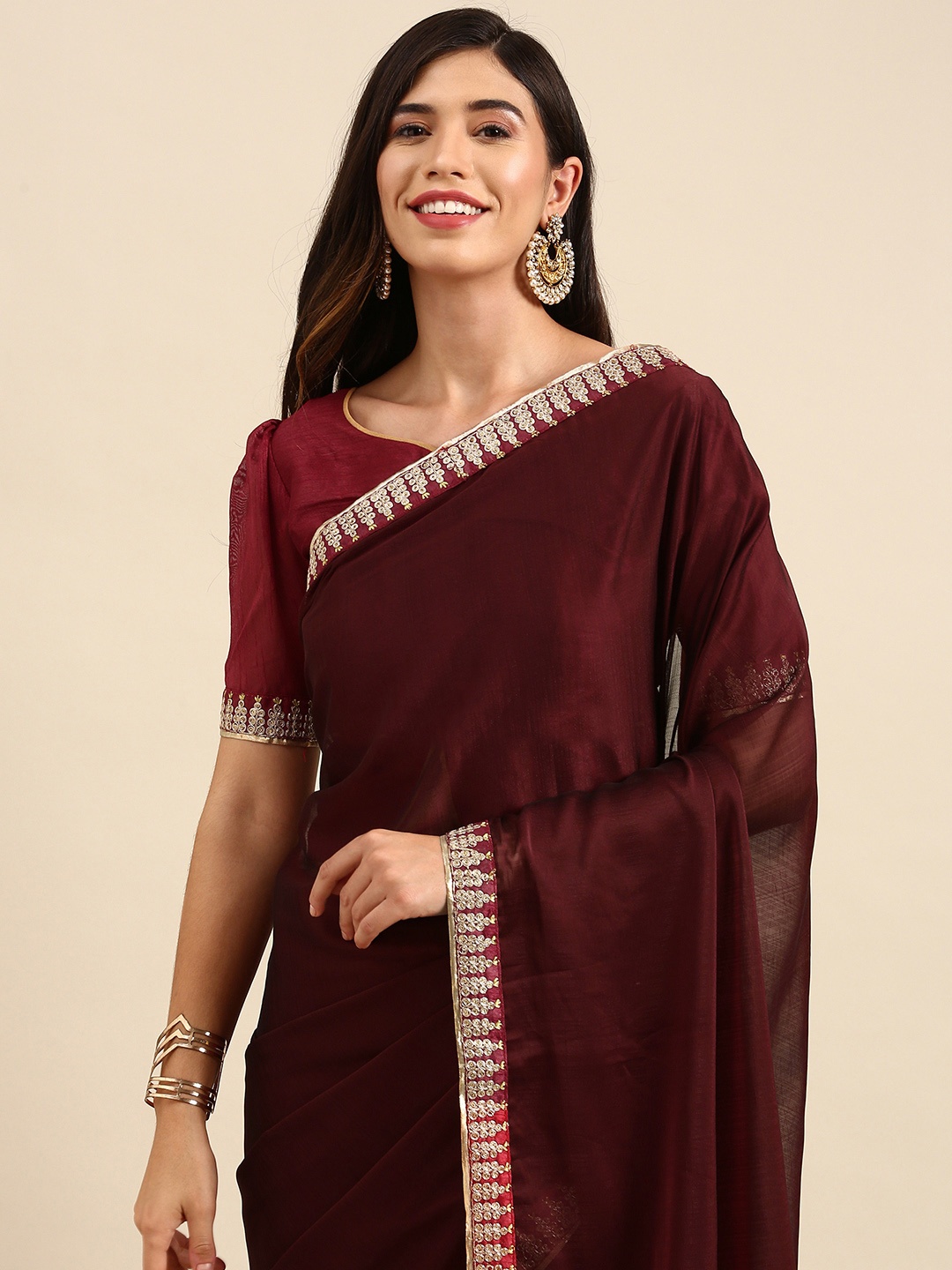 

Anouk Maroon Solid Saree with Embellished Border