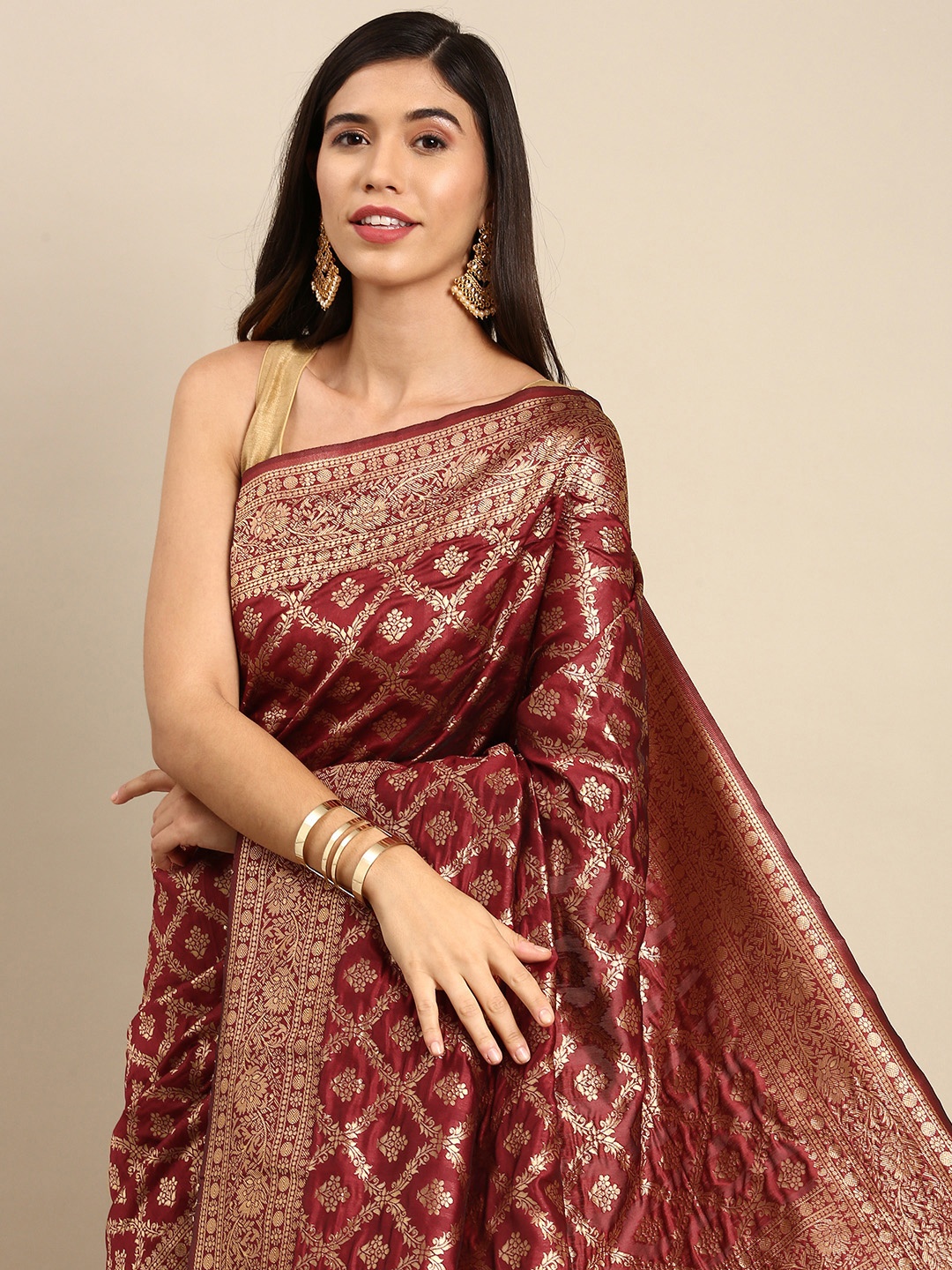 

Anouk Maroon & Golden Ethnic Motifs Zari Woven Design Banarasi Saree