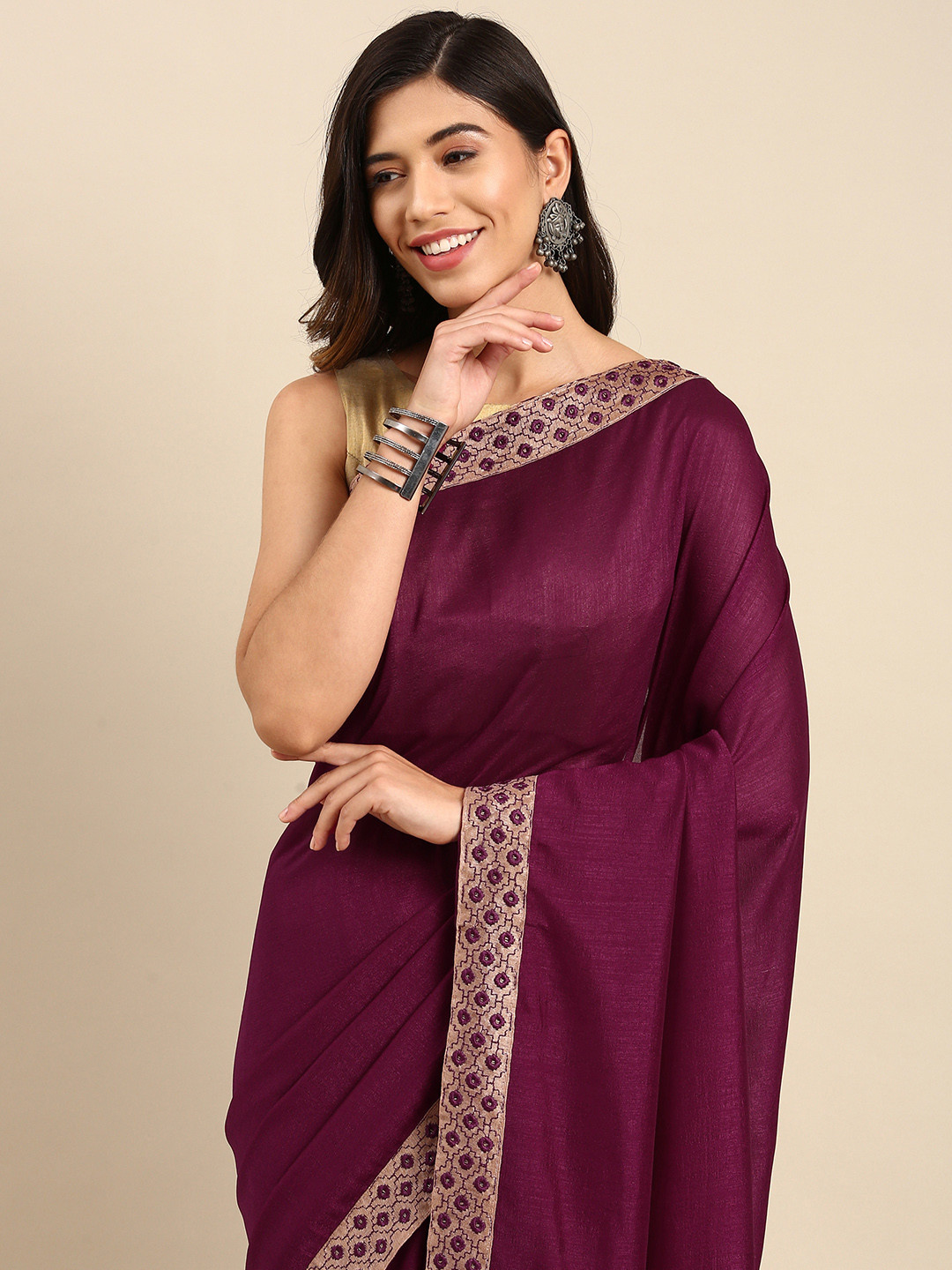 

Anouk Burgundy Solid With Embroidered Border Silk Blend Saree