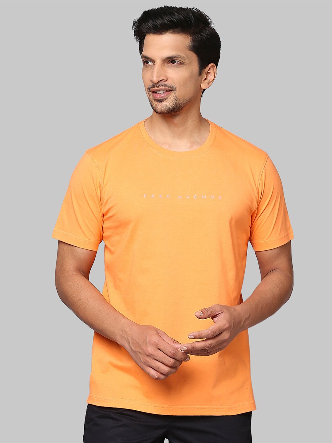 

Park Avenue Men Orange & White Typography Printed Raw Edge Slim Fit T-shirt