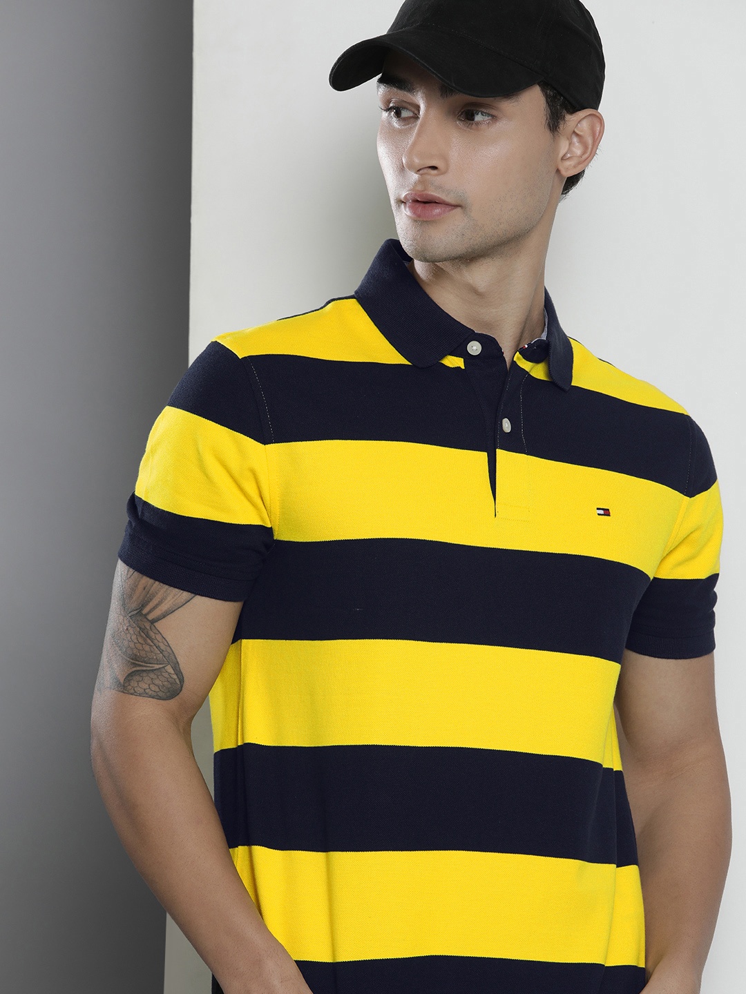 

Tommy Hilfiger Men Yellow & Black Striped Polo Collar Pure Cotton T-shirt
