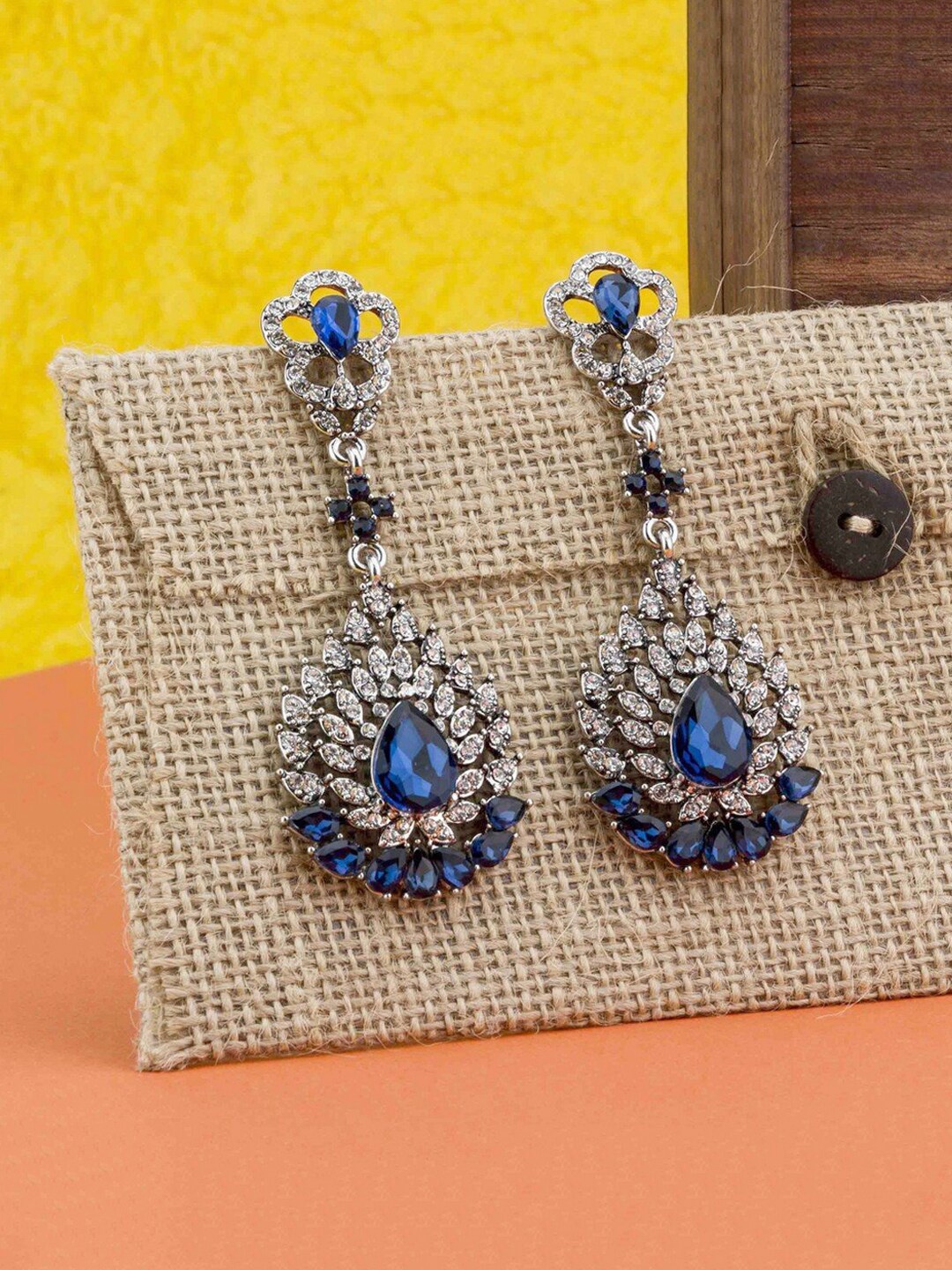 

Yellow Chimes Silver-Plated & Blue Crystal Studded Teardrop Shaped Drop Earrings